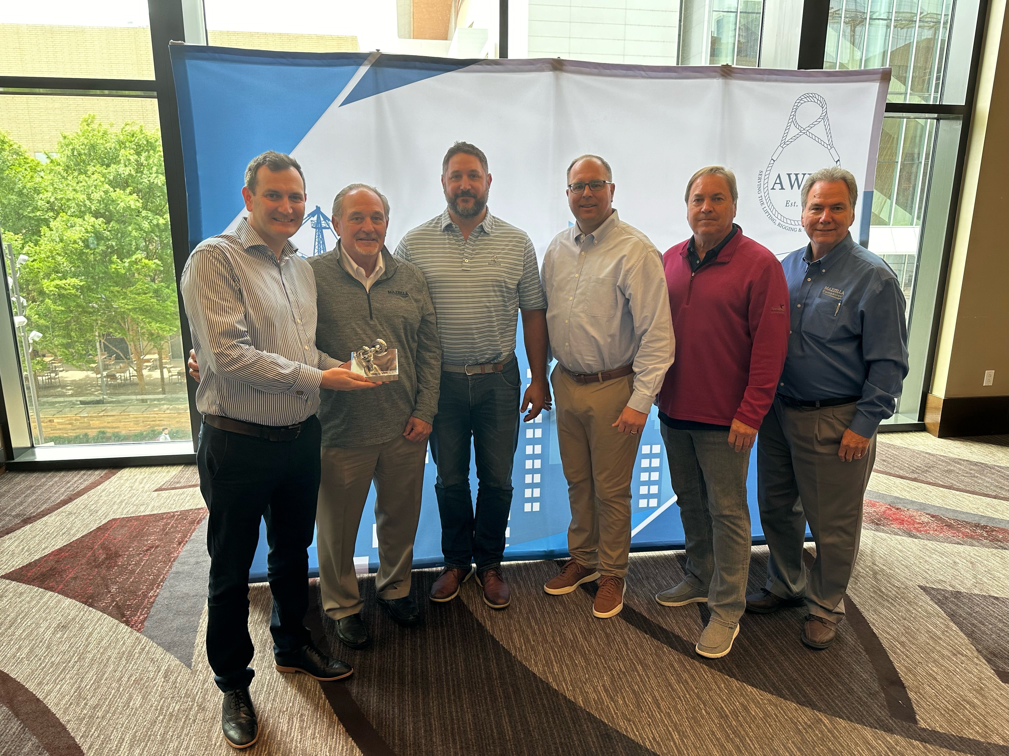 Caption: Ross Moloney, CEO, LEEA presents the award for the best contribution from a company or individual to #GLAD2023 to (left to right) Mazzella’s Tony Mazzella, CEO; Matt Mazzella, president; Eric Parkerson, vice president of rigging; Mike Lindsey, vice president of supply chain; and Jim Takacs, director of corporate supply chain.