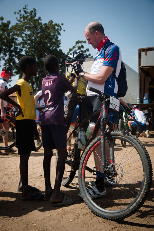 Hans Bourlon lets local kids check out his bike
