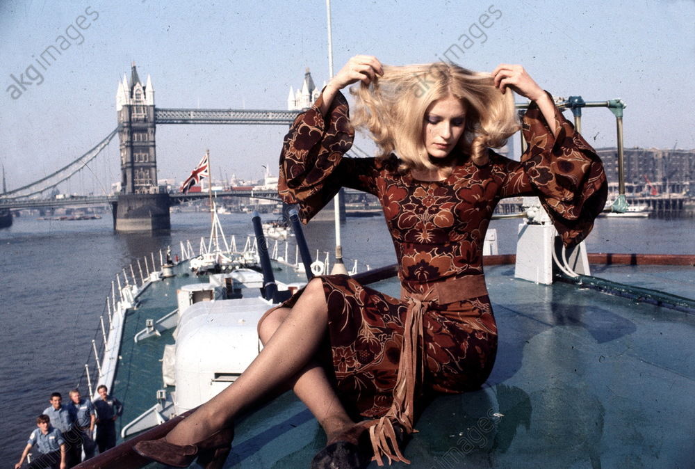 Young Woman Modelling a Mary Quant Dress on a Boat in Front of Tower Bridge, London, 1971. AKG5862093