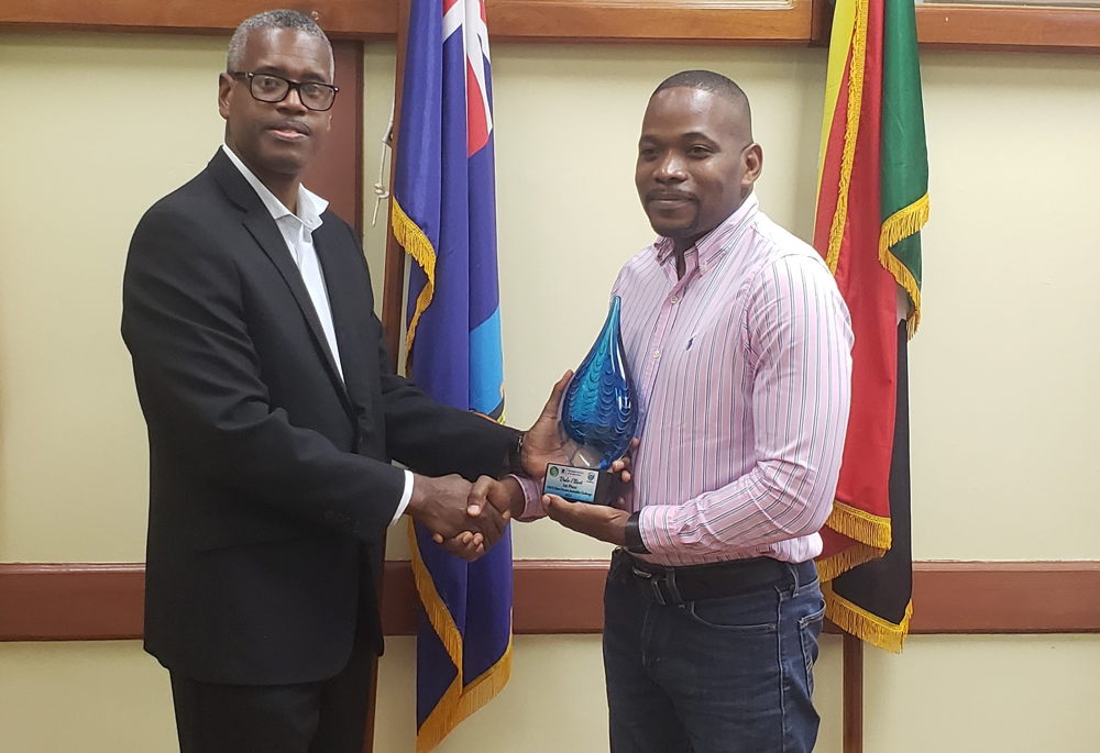 1st Place Winner – Dale Elliot, receiving his prize from David Robin, Programme Director - Ocean Governance & Fisheries Unit