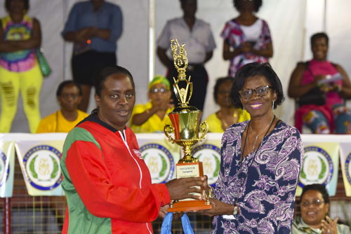 Anna Maria Xavier (left), accepts the most disciplined team trophy from Maxine Cottle