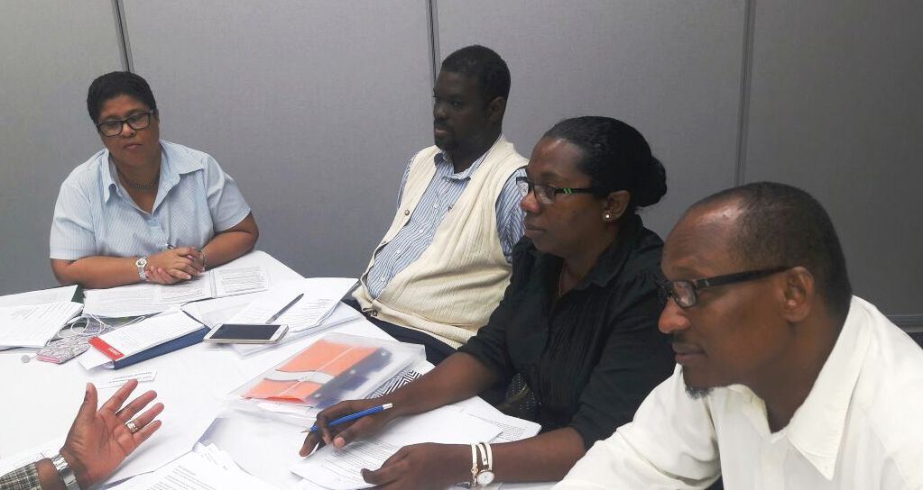 Group discussions continue.
