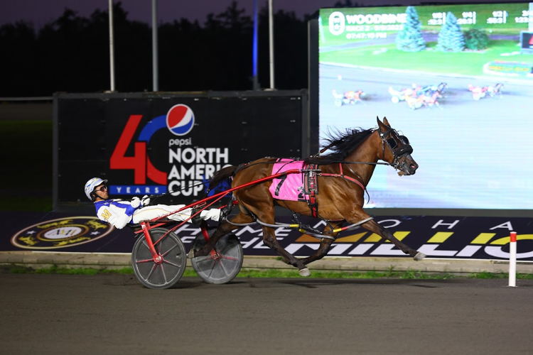 Pass Line and driver James MacDonald winning the first Champlain division for 2-year-old fillies on September 9, 2023 at Woodbine Mohawk Park (New Image Media) 
