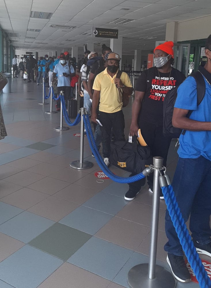 Farm workers from the OECS prepare for departure to Canada.