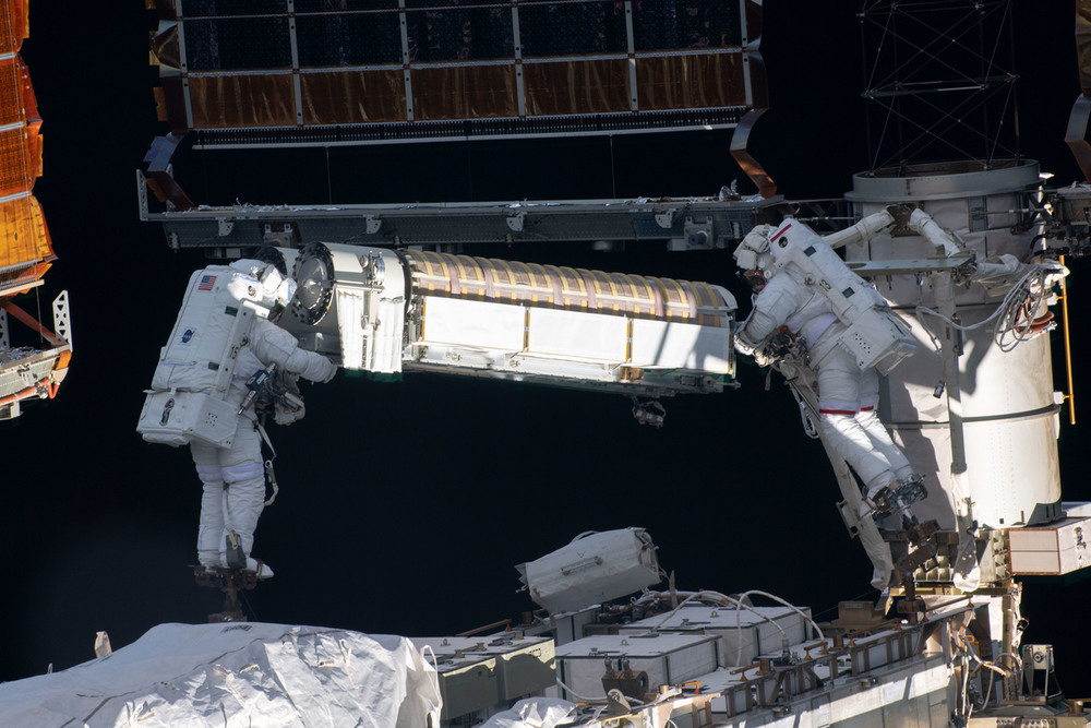 Astronauts Shane Kimbrough of NASA (left) and Thomas Pesquet of the European Space Agency (right) work to install new roll out solar arrays on the International Space Station during a spacewalk that took place on June 20, 2021. AKG9036328 © akg-images / Science Source