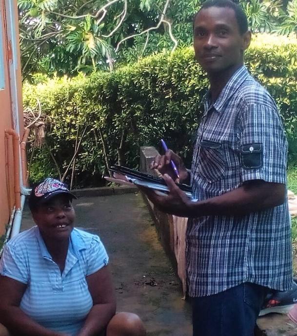OECS Statistical Services Unit (SSU) and St. Lucia's Central Statistical Office (CSO) staff members conducting a survey with the use of tablets.