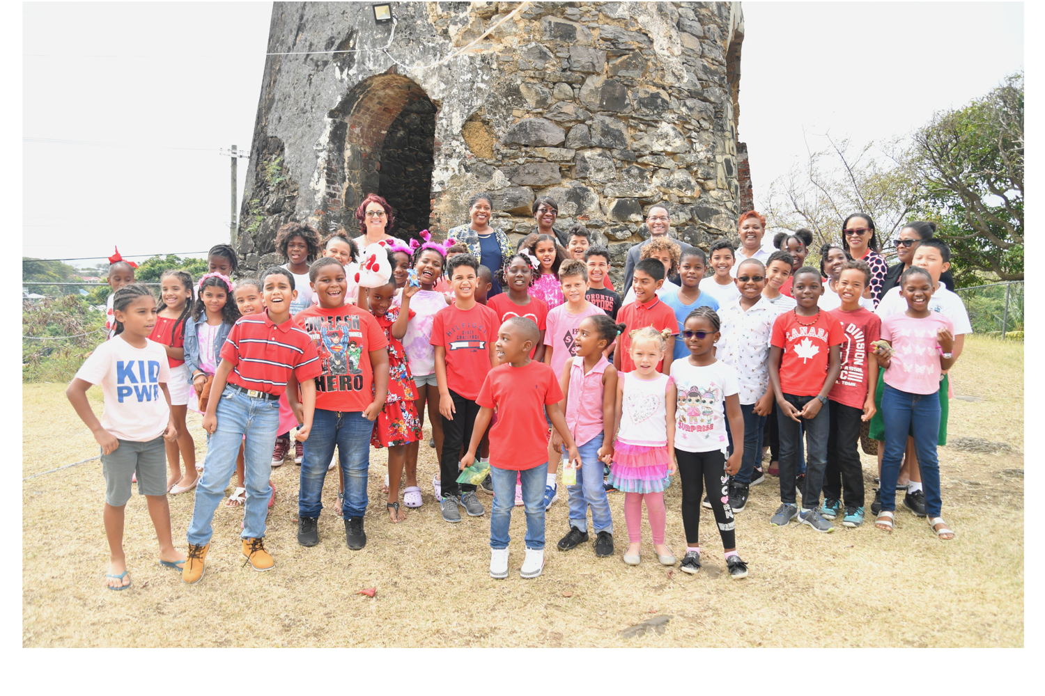 Mr. Clinton White , USAID Representative to the Eastern and Southern Caribbean with Sugar Mill staff, students and Ministry of Education.JPG