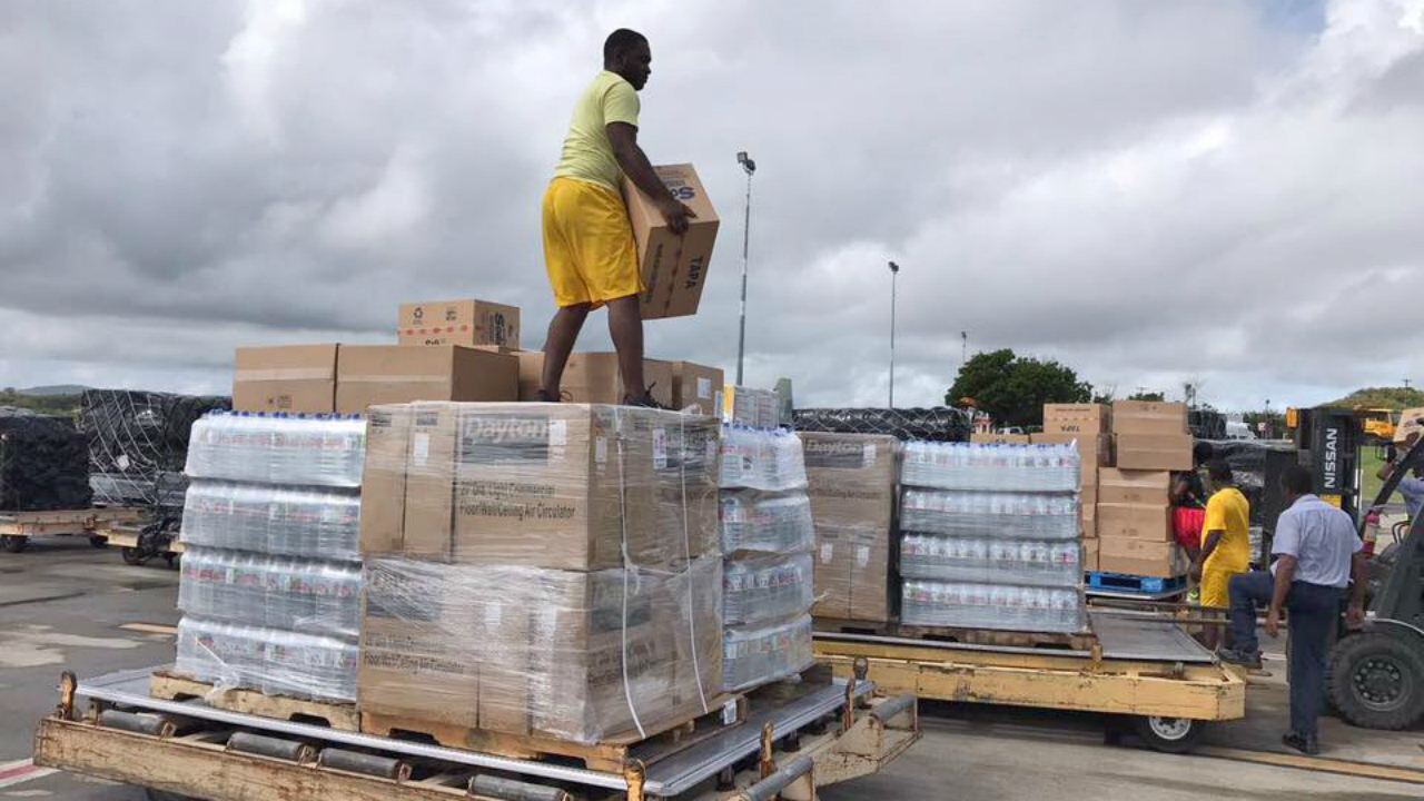 Receipt and distribution of relief items (Photo courtesy ABS TV)