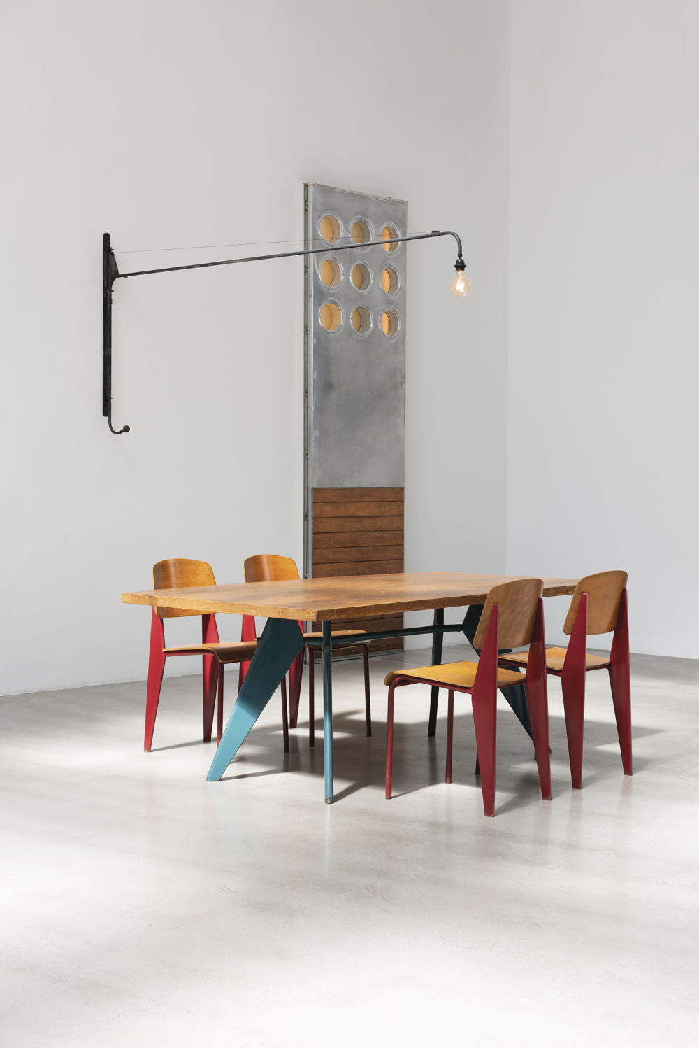 Galerie Patrick Seguin presents 'S.A.M. no. 506 table' (ca. 1951), 'Metropole no. 305 chairs' (ca. 1950), 'Panel with portholes' (1950) and 'Swing-jib lamp no. 602' (1952) by Jean Prouve. Image courtesy of Galerie Patrick Seguin. Galerie Patrick Seguin presents 'S.A.M. no. 506 table' (ca. 1951), 'Metropole no. 305 chairs' (ca. 1950), 'Panel with portholes' (1950) and 'Swing-jib lamp no. 602' (1952) by Jean Prouve. Image courtesy of Galerie Patrick Seguin.