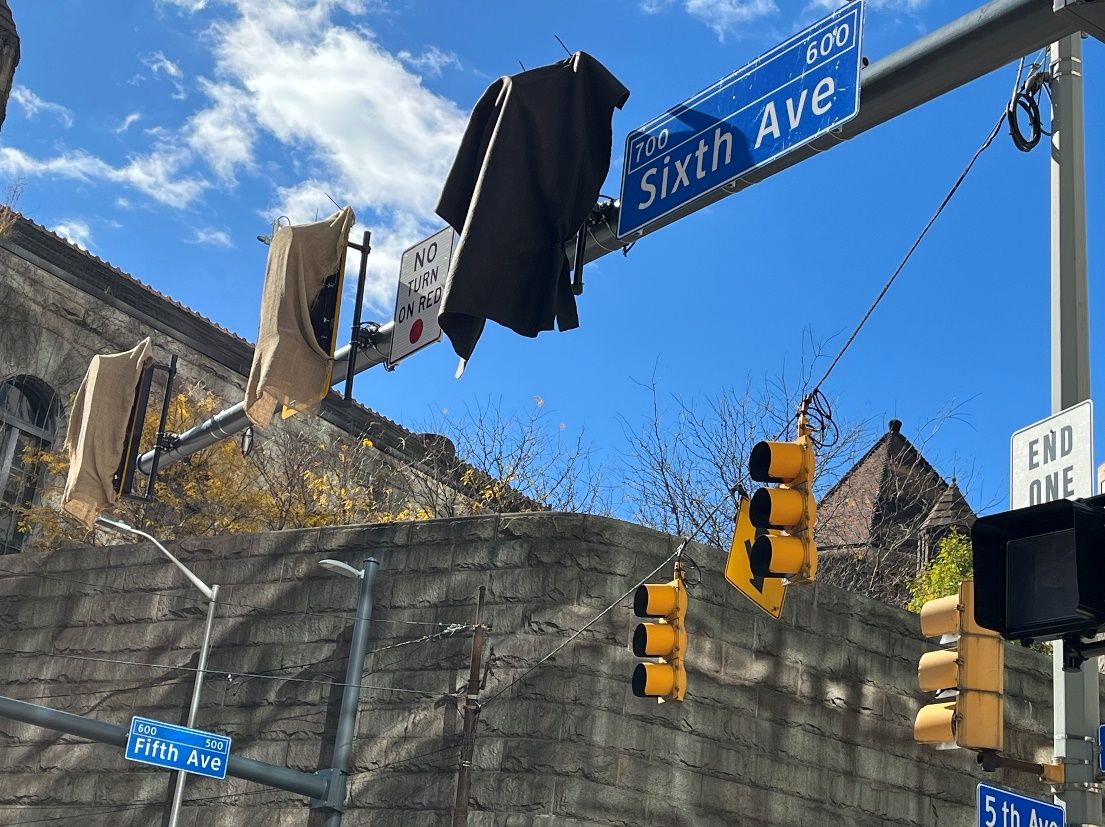 New traffic signals installed and covered with burlap at Fifth and Sixth avenues