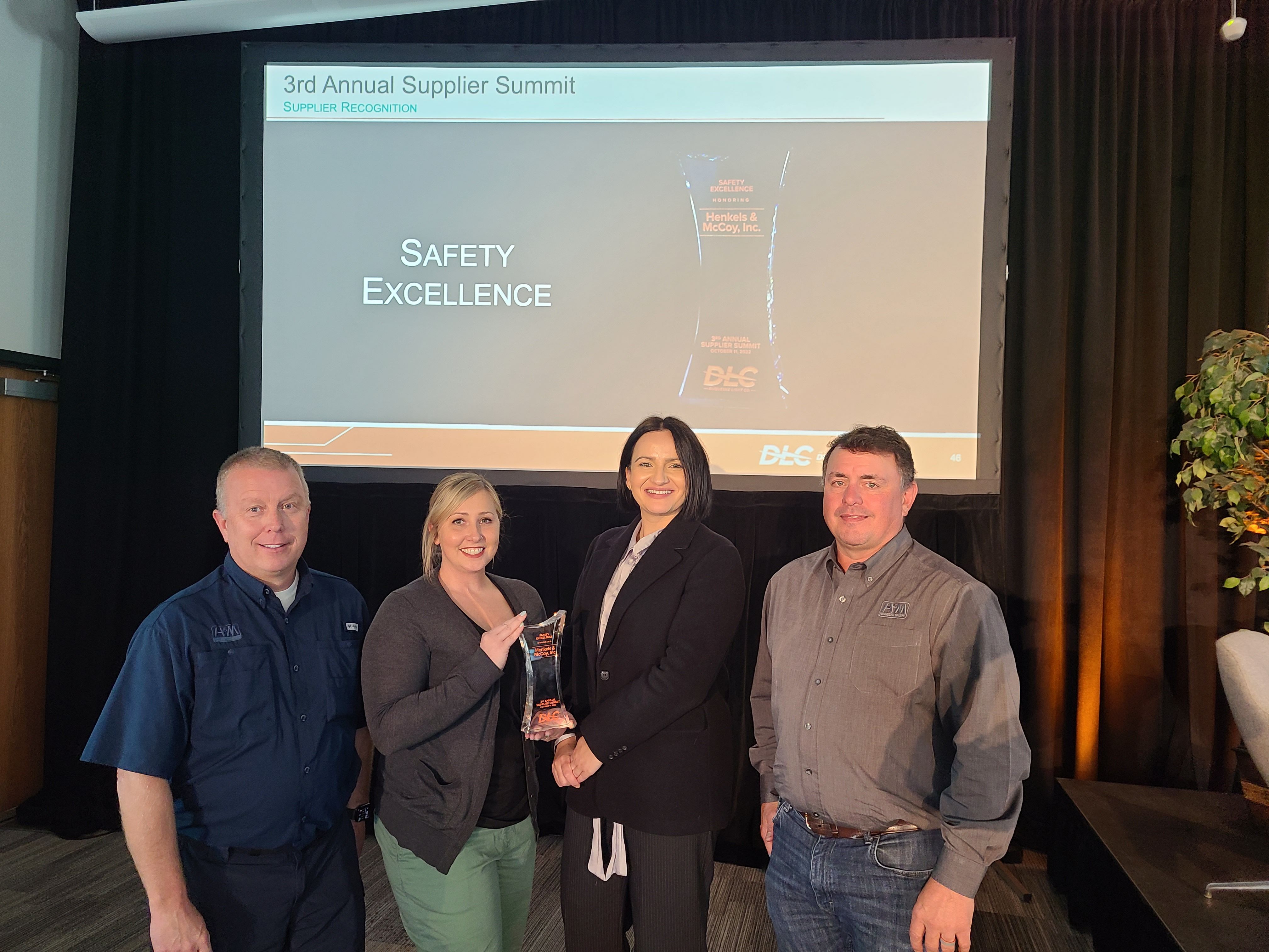 DLC Procurement Manager Aida Filipovic (second from right) pictured with representatives from Henkels & McCoy, which received recognition for Safety Excellence.
