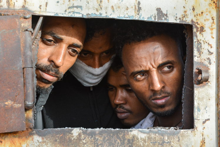 1) Between 5,000 and 6,000 refugees and migrants are being held arbitrarily in Libya’s detention centres, nominally under the authority of the Tripoli-based Ministry of Interior. 

Their situation has become even more perilous in recent months with the conflict between the Libyan Government of National Accord (GNA) and the Libyan National Army (LNA), which started in early April. But despite repeated calls for their protection and evacuation, the detained refugees and migrants have little prospect of reaching safety any time soon. Meanwhile, more people are being forcibly returned to the same cycle of violence and detention in Libya by the EU-supported Libyan coast guard. 

Away from the battle area, hundreds remain locked up for an indefinite period in harmful conditions, exposed to abuses and deaths, and driven to desperation. © Jérôme Tubiana/MSF