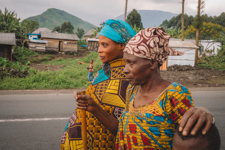Copyright: Philémon Barbier Countries: Democratic Republic of Congo Date taken / Date Recorded: 04 January, 2024 Caption / Description: Jeanne, 64, walks down a street in Kibati, north of Goma, North Kivu, in the Democratic Republic of Congo, with her daughter Aimée Zawadi, 26, and one of her children, on 4 January 2024.