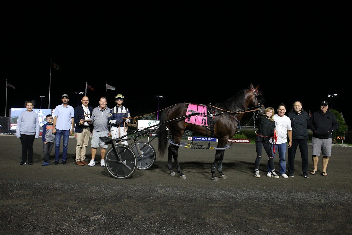 Mirage Hanover in the winner's circle for  the third division of the Nassagaweya on August 26, 2023 at Woodbine Mohawk Park (New Image Media)