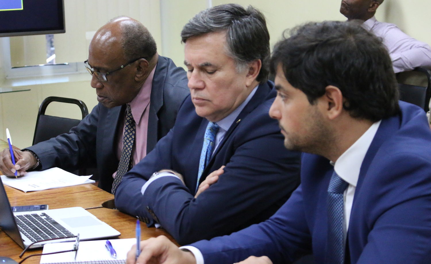 Mr. Manuel Otero joined by Dr. Arlington Chesney, Executive Director of the Caribbean Agricultural Research and Development Institute (left); and Mr. Nicolás Carlos Abad, Chargé d'Affairs at the Embassy of the Argentine Republic to Saint Lucia (right).
