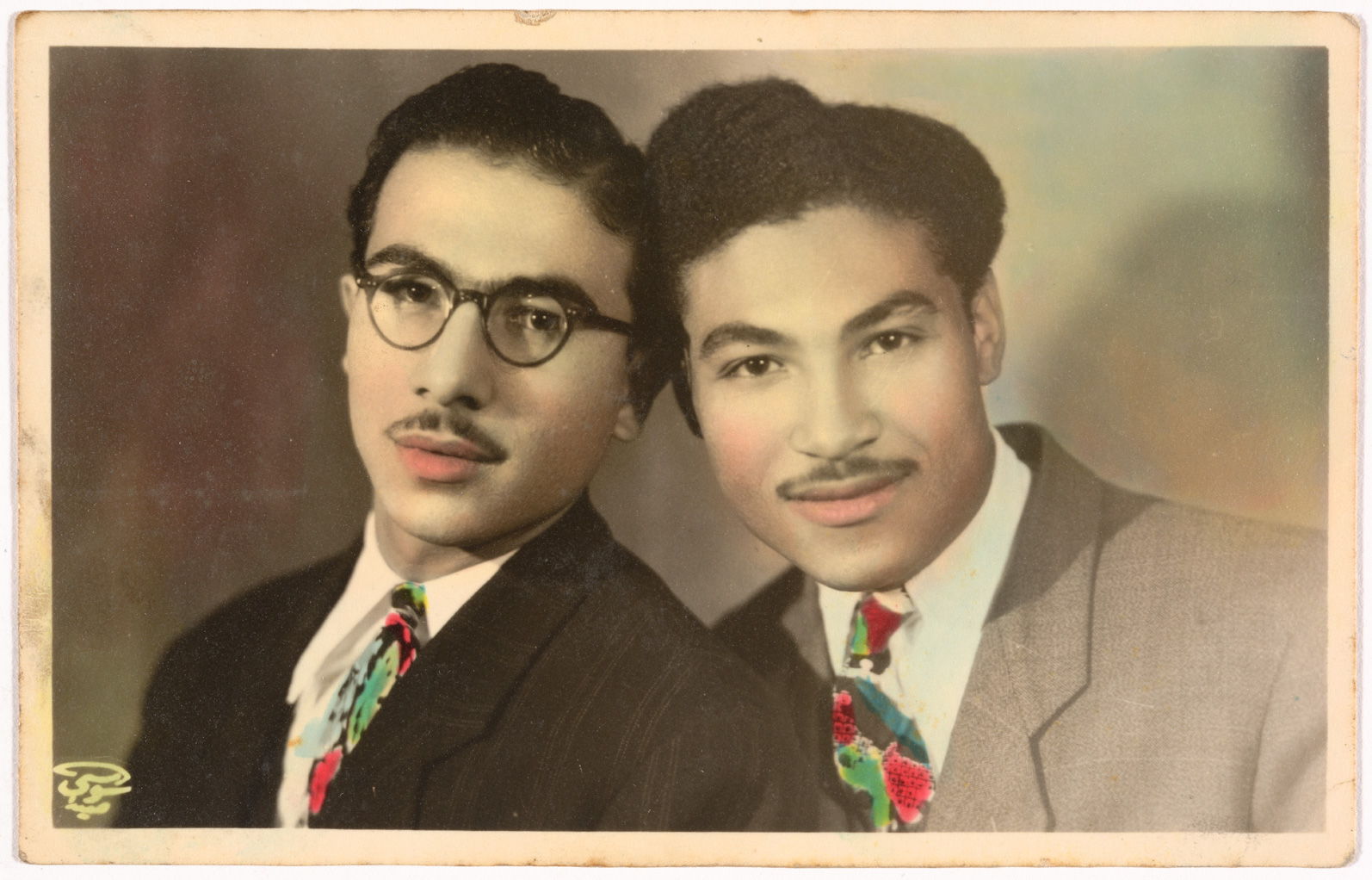 Hand-coloured portrait of Hussein and Ahmed Assad by Anis el Soussi in Lebanon, January 1, 1946, gelatin silver developing-out paper print. Fahime Zeidan Collection, courtesy of the Arab Image Foundation