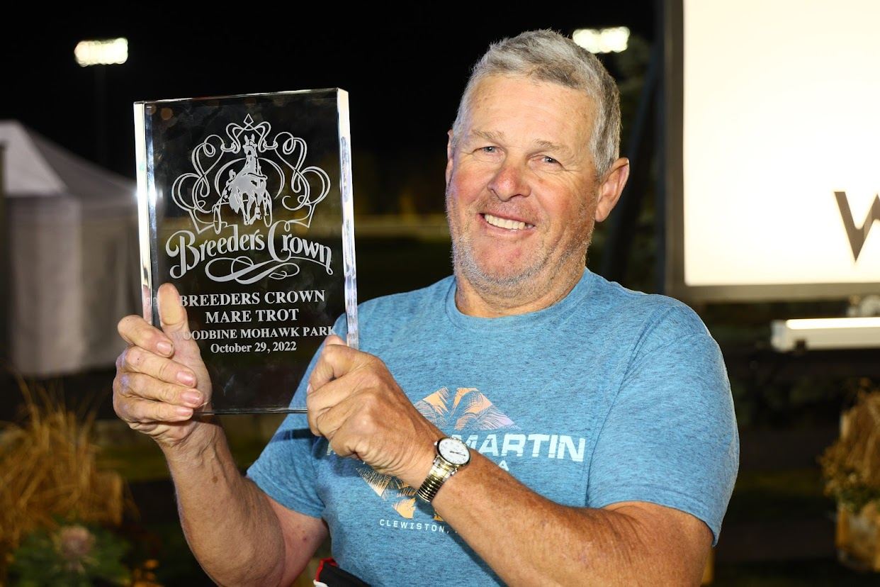 Trainer of Bella Bellini, Nifty Norman, celebrating winning the Open Mare Trot Breeders Crown Final (New Image Media)