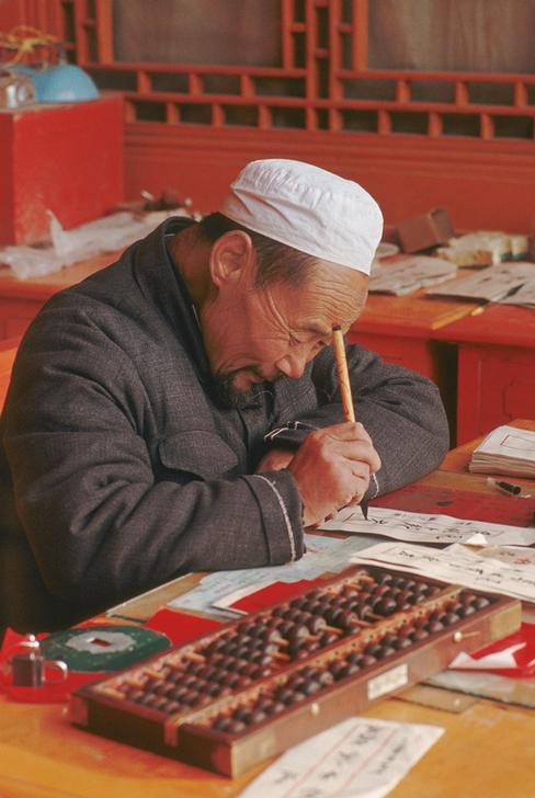 Public scribe writing Chinese calligraphy, china, undated. AKG1710809