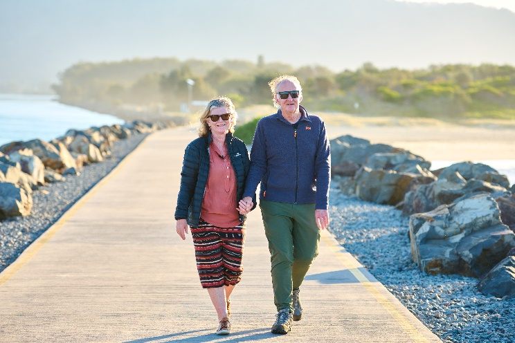 Dale & Peter Feeney walking along the Laurieton Breakwall