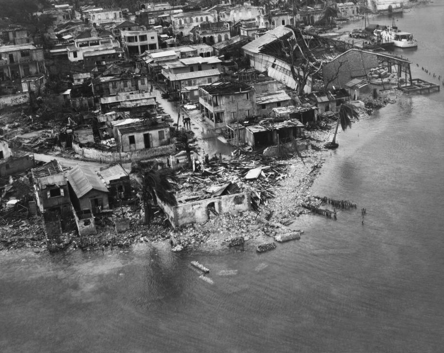 Haitian waterfront in ruins in the wake of Hurricane Flora in 1963. The storm produced winds of up to 120 miles per hour, produced storm surges of over 12 feet, and dropped torrential rain on the country, causing flash floods and mudslides. About 5,000 people died, and towns, cities and crops were entirely destroyed. AKG8125529 © akg-images / Omikron / SCIENCE SOURCE Haitian waterfront in ruins in the wake of Hurricane Flora in 1963. The storm produced winds of up to 120 miles per hour, produced storm surges of over 12 feet, and dropped torrential rain on the country, causing flash floods and mudslides. About 5,000 people died, and towns, cities and crops were entirely destroyed. AKG8125529 © akg-images / Omikron / SCIENCE SOURCE