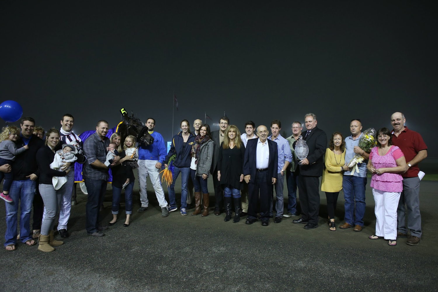 Carmen Auciello and family in the winner's circle on September 28, 2013 after Bugger Bruiser's Super Final win at Woodbine (New Image Media)