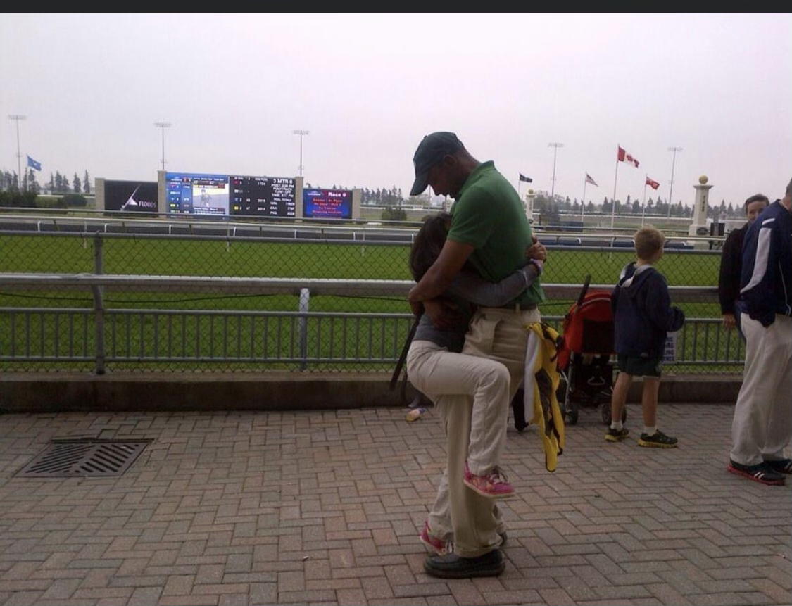Ricky and daughter Vivian Sophia embrace at Woodbine 