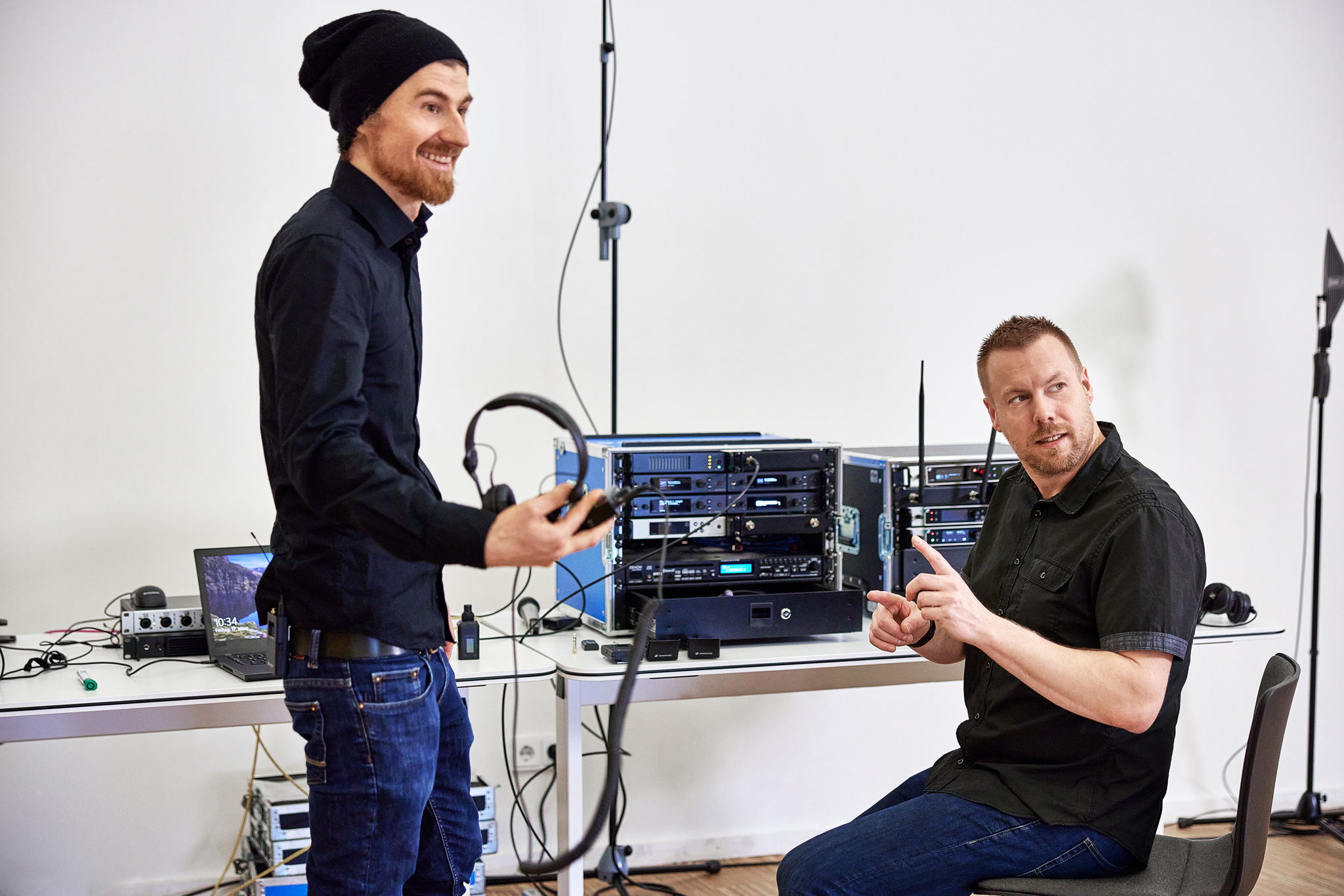 Marco and Jonas with the RF equipment. Narrowband IEM transmitters and mic receivers centre and right; the 1U, 19” WMAS prototype on the left