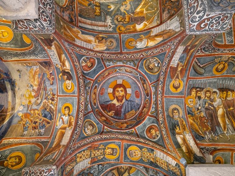 Christ Pantocrator, blessing and holding the gospel, with medallions of St Thomas, St Philip, St Prochorus and St Thaddeus, frescoes, 1000-50 by Constantinople artists, on the central dome of the Karanlik Church or Dark Church. AKG10885277 © akg-images / Manuel Cohen 