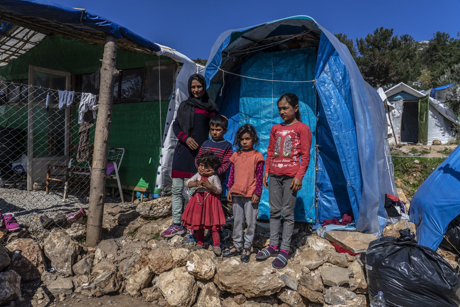 Farida arrived from Afghanistan with her husband and four children in early March. She has been living in the jungle next to Vial camp ever since.

"We have a very bad life here, we are not safe. The toilets are so far away and we cannot get there especially at night because it's really dark and there are no lights. I wont go anywhere without my husband because I am afraid." Credit Anna Pantelia/MSF, 7 March 2019