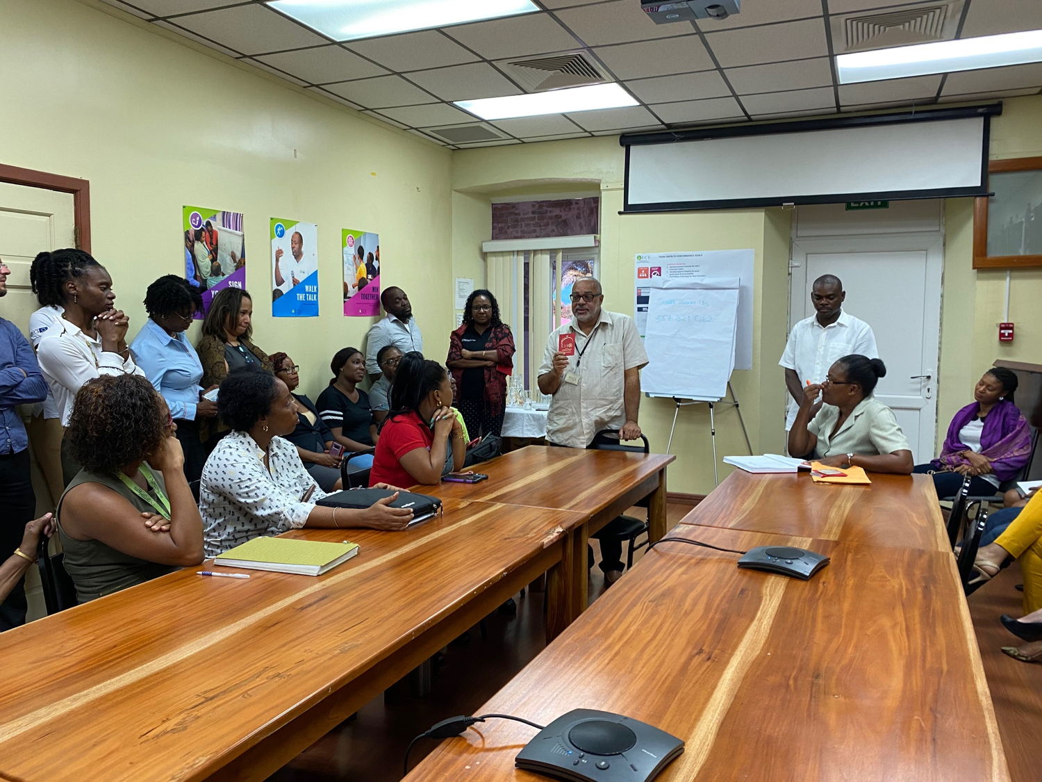 First batch of new Electronic Laissez-Passers are presented to staff of the OECS Commission.