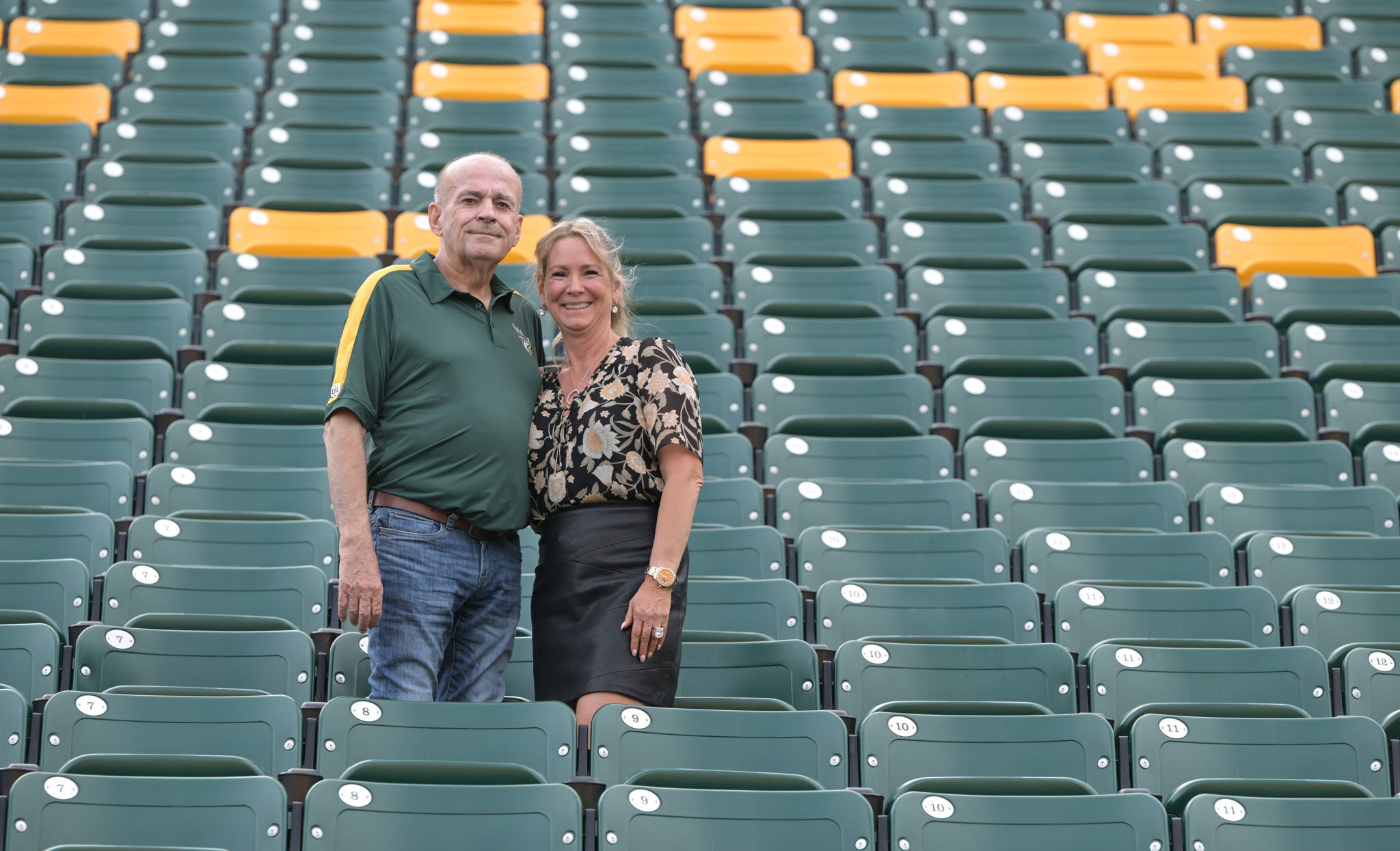 Larry and Deb Thompson pictured in section H at Commonwealth Stadium. Thompson has held the same seats at Commonwealth since the Club moved to the stadium in 1978.