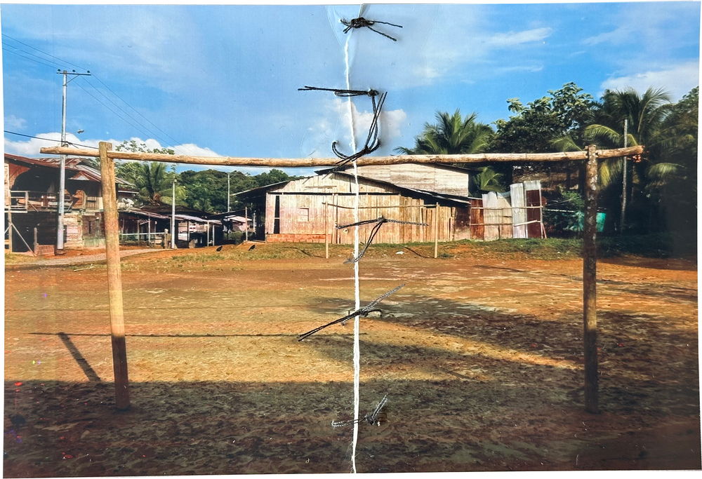 Carmen Fidela Mena, in Chachajo, stitched up a photograph of a soccer field where the community watched its leaders being killed. Chachajo, Alto Baudó, Chocó.