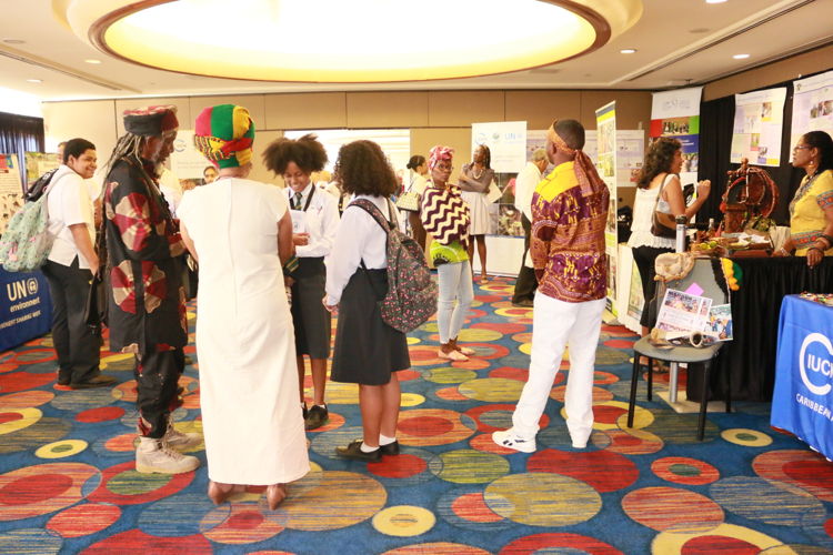 Students mingle with participants at the Biodiversity Exposition.