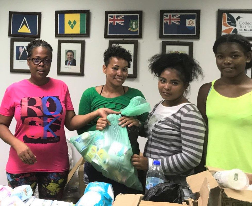 Family receiving aid at the OECS Dominica Office.