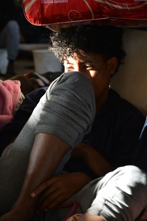 6) People detained in Zintan are mostly fleeing persecution and violence from Eritrea and Somalia. 

Some have been in Zintan detention centre since March 2017. The most recent arrivals were brought to the detention centre in May after being arrested at a checkpoint. But the majority were transferred to Zintan from various Tripoli detention centres in September 2018 after fighting broke out in the capital. 

During recent episodes of fighting in Tripoli, some refugees and migrants reportedly refused to be transferred, rightly fearing they would be forgotten in Zintan, out of sight and with little access to medical care.  © Jérôme Tubiana/MSF