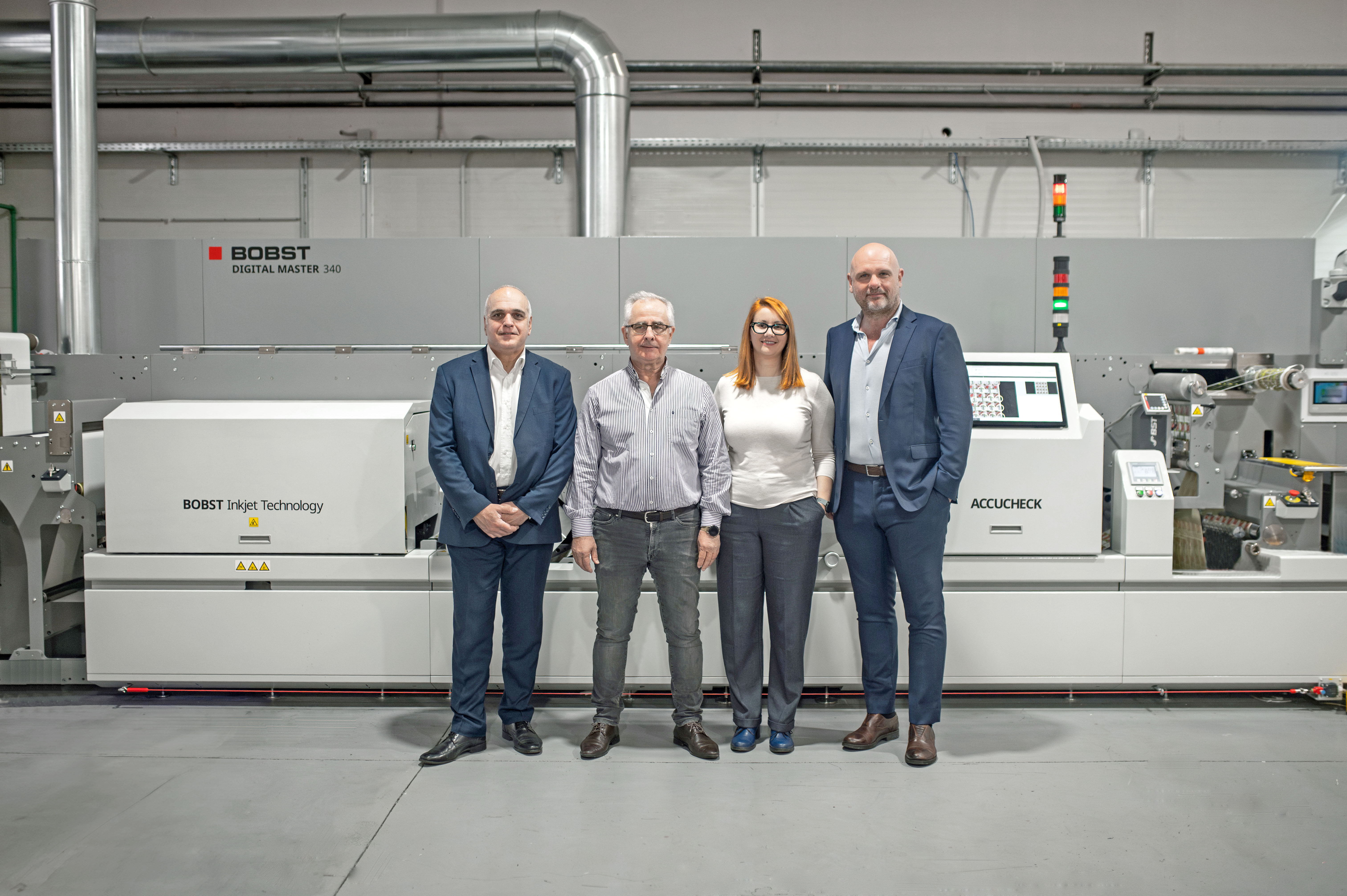 From left to right: C. Kourtis from Omnicom, BOBST authorized agent in Greece, the CEO of the label company S. Batsios, the executive officer D. Batsiou, and M. Luini, Technical Sales Manager from BOBST. From left to right: C. Kourtis from Omnicom, BOBST authorized agent in Greece, the CEO of the label company S. Batsios, the executive officer D. Batsiou, and M. Luini, Technical Sales Manager from BOBST.