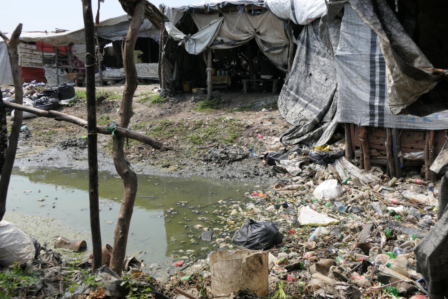 A garbage area in the main street market of Bentiu IDP camp. People buy all sorts of items in the tents surrounding the garbage, including food. Copyright: Damaris Giuliana/MSF