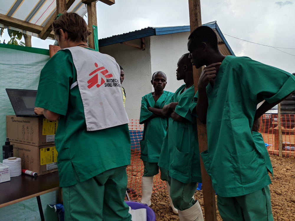 Maria, watsan specialist, putting the final touches to the dressing section of the TC. Photographer: Karin Huster/MSF