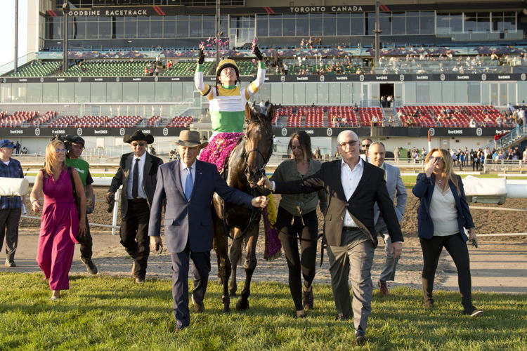 Touch'n Ride, jockey Kazushi Kimura, and connections making their way to the winner's circle for the Breeders' Stakes on October 1, 2023 at Woodbine (Michael Burns Photo)