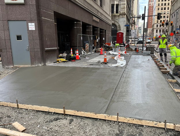 New concrete sidewalk recently poured at Sixth Avenue and Wood Street