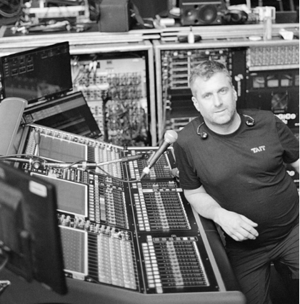 Monitor Engineer Saul Skoutarides behind the mixing console. Monitor Engineer Saul Skoutarides behind the mixing console.