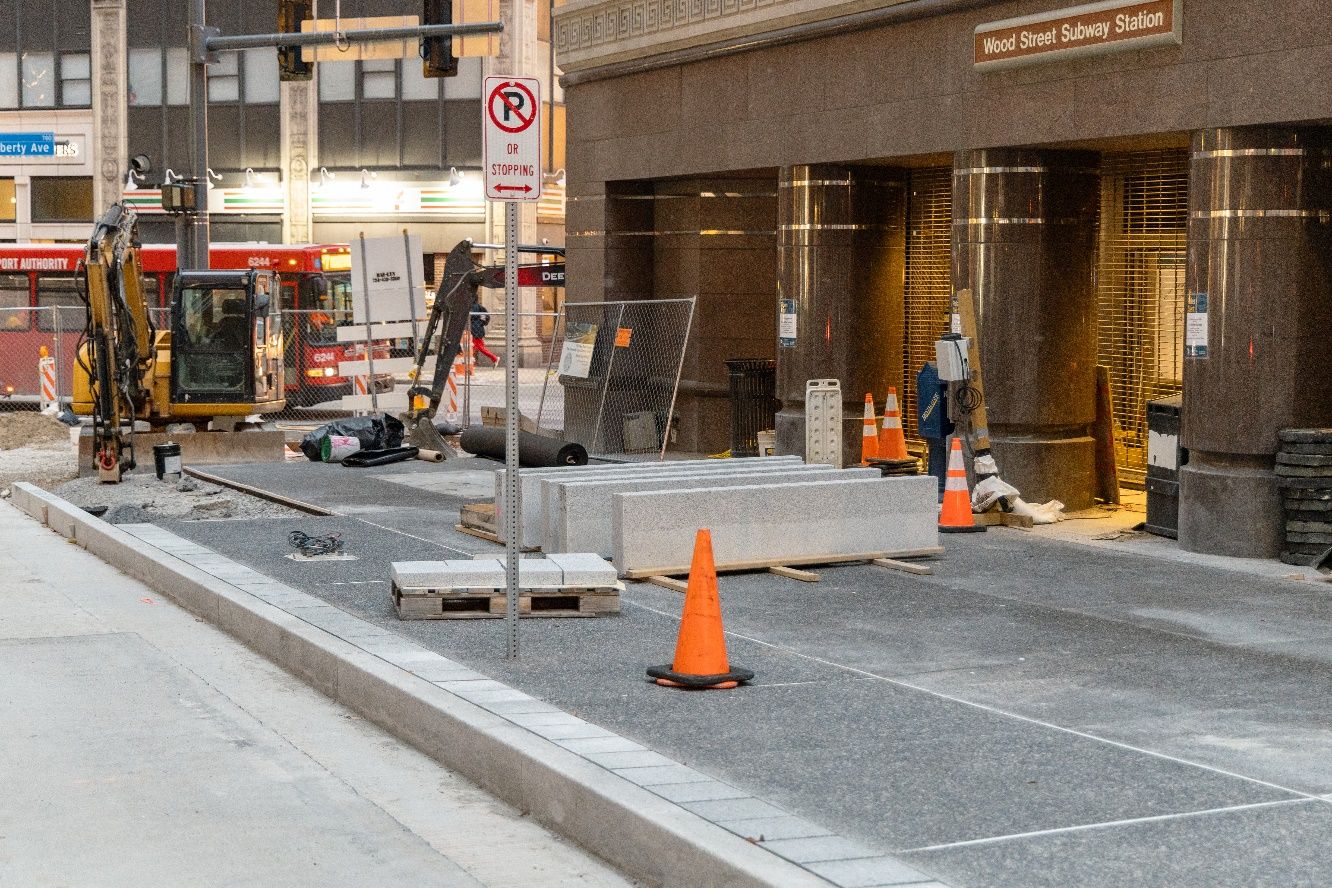 New sidewalk and granite curbs recently placed at Wood Street Station