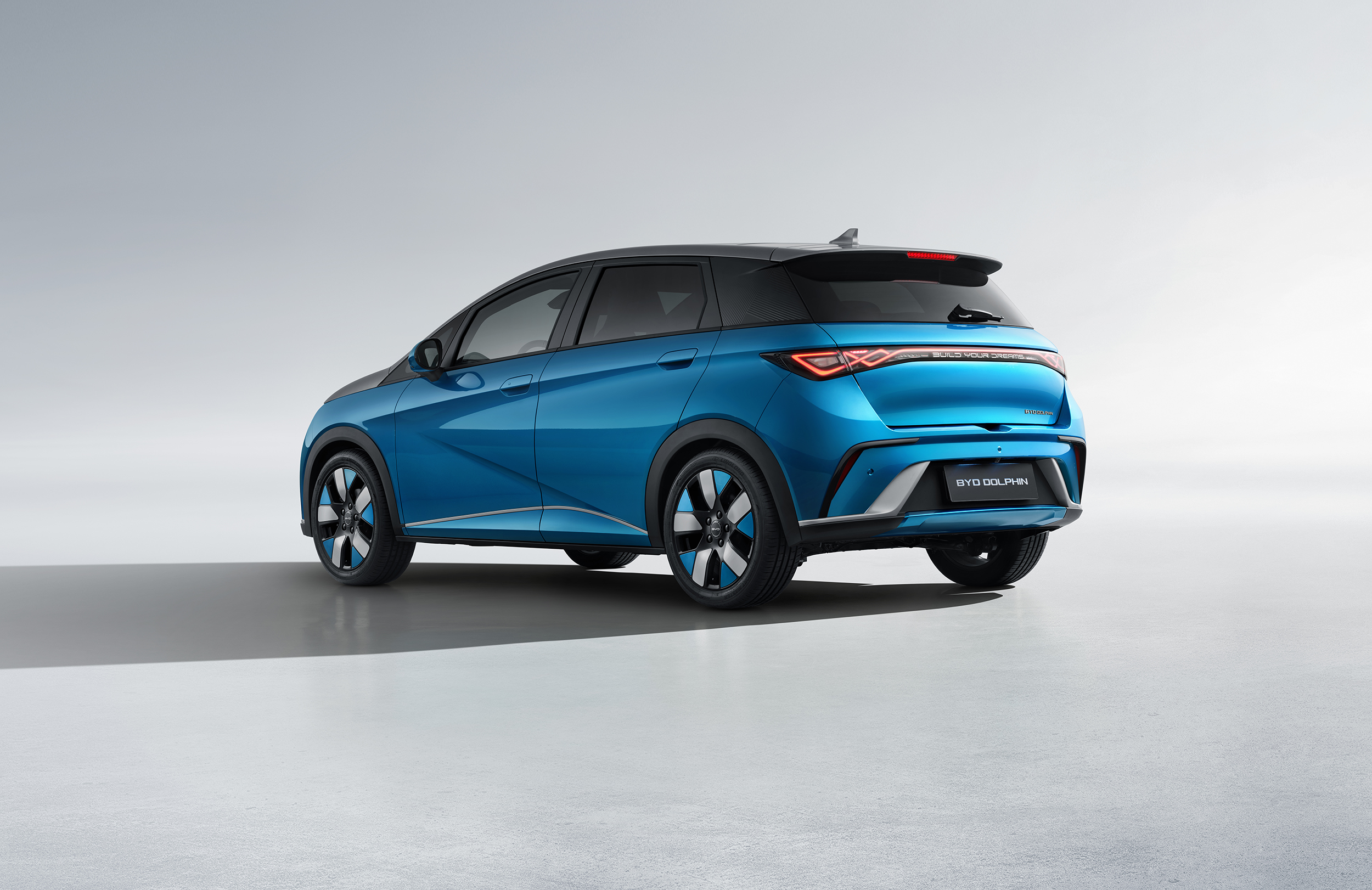 BYD DOLPHIN Comfort 60.4 kWh — Rear three-quarter · official media image