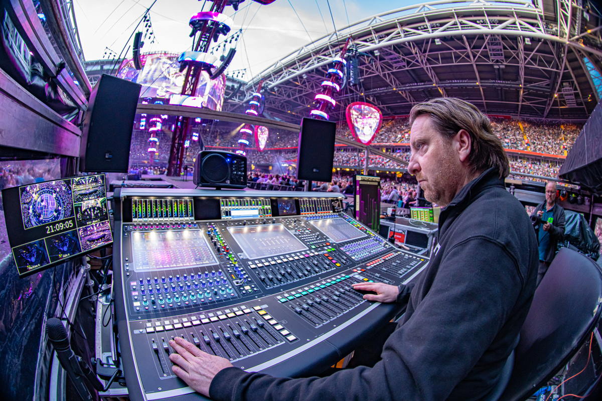 Chris Marsh mixes both FOH and monitors.  Photo credit: Ralph Larmann