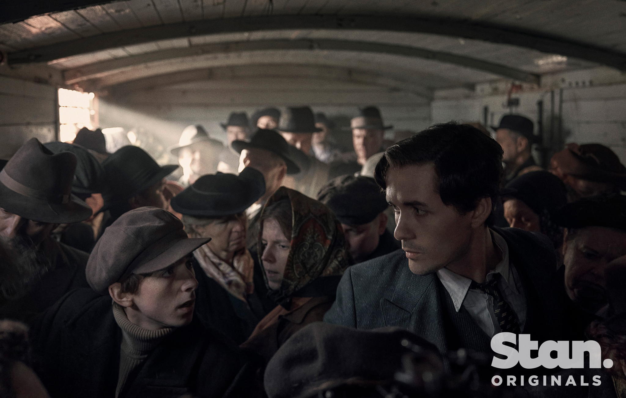 Caption: Jonah Hauer-King as Lali Sokolov, seen here as he boards the train to Auschwitz (Credit: © Martin Mlaka / Sky UK) Caption: Jonah Hauer-King as Lali Sokolov, seen here as he boards the train to Auschwitz (Credit: © Martin Mlaka / Sky UK)