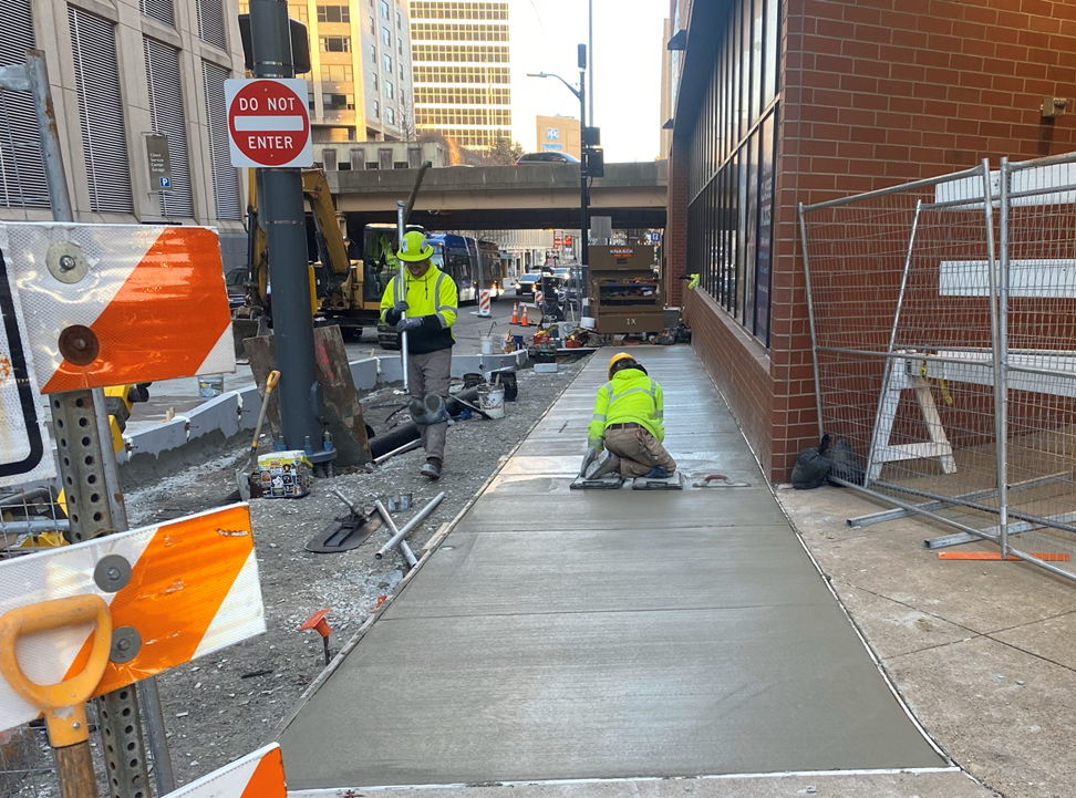 PRT’s contractor placing new sidewalk at Fifth and Sixth Avenue