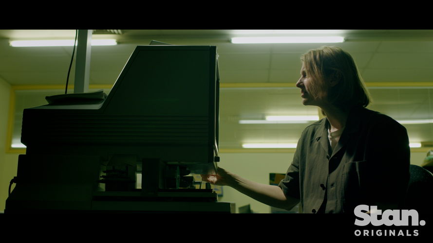 Kathryn Joy searches microfiche archives
