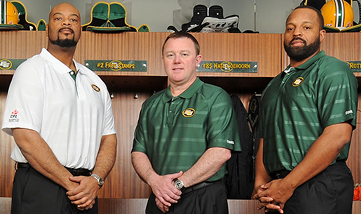 Chris Jones (centre) introduces Stephen McAdoo (left) and Jarious Jackson (right) as part of his first Edmonton coaching staff back in January 2014.
