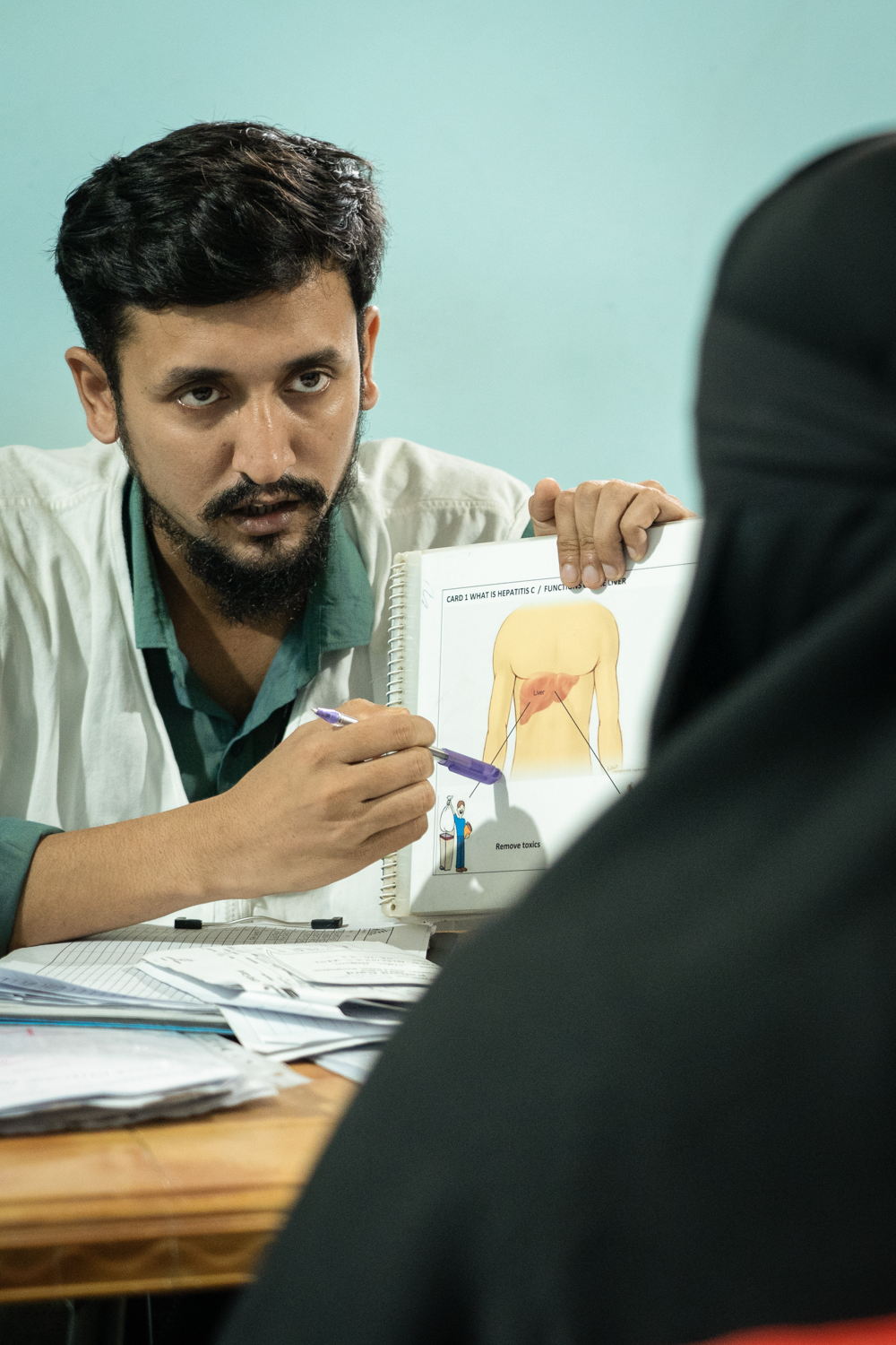 Taraqul Islam is a counsellor educator working at MSF’s Jamtoli clinic at the Rohingya refugee camp in Ukhiya, Cox’sbazar, Bangladesh. He provides counselling to patients suffering from Hep C; also provides information about Hep C. | Date taken: 26/05/2024 | Photographer:Abir Abdullah Taraqul Islam is a counsellor educator working at MSF’s Jamtoli clinic at the Rohingya refugee camp in Ukhiya, Cox’sbazar, Bangladesh. He provides counselling to patients suffering from Hep C; also provides information about Hep C. | Date taken: 26/05/2024 | Photographer:Abir Abdullah