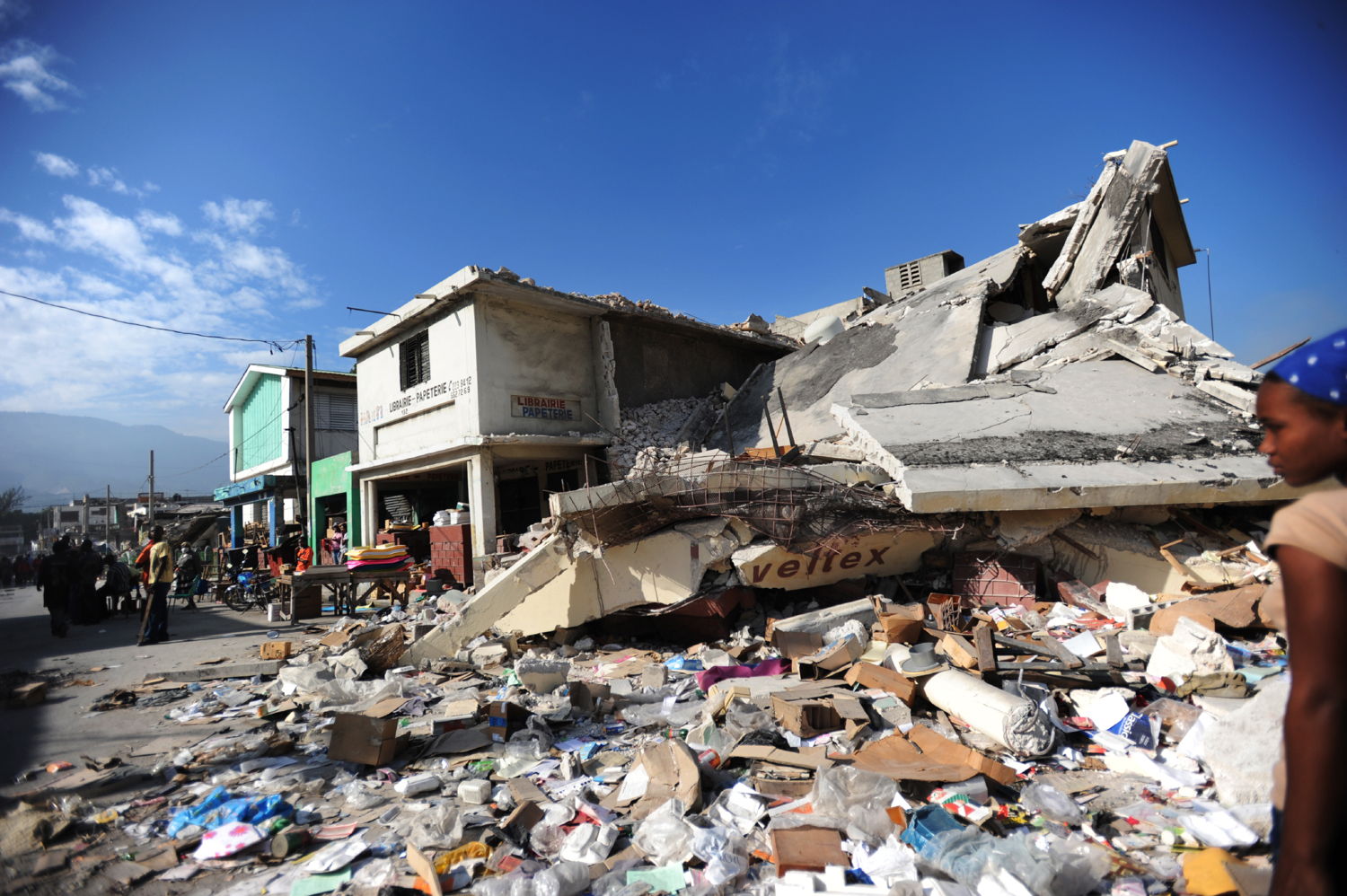 Collapsed building and rubble in Port-au-Prince city centre, 21 Jan 2010. Copyright: Julie Remy